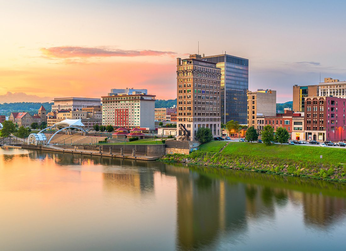 Contact - Aerial View of Charleston, West Virginia During Sunset With a Reflective River